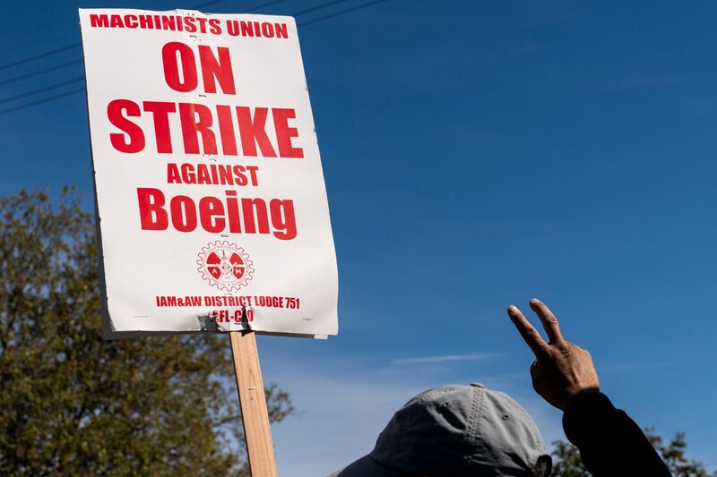 A worker pickets outside the Boeing Co. manufacturing facility during a strike in Renton, Washington, US, on Thursday, Oct. 3, 2024. Boeing Co. factory workers walked off the job for the first time in 16 years, halting manufacturing across the planemaker's Seattle hub after members of its largest union voted overwhelmingly to reject a contract offer and go on strike. A worker pickets outside the Boeing Co. manufacturing facility during a strike in Renton, Washington, US, on Thursday, Oct. 3, 2024. Boeing Co. factory workers walked off the job for the first time in 16 years, halting manufacturing across the planemaker's Seattle hub after members of its largest union voted overwhelmingly to reject a contract offer and go on strike.