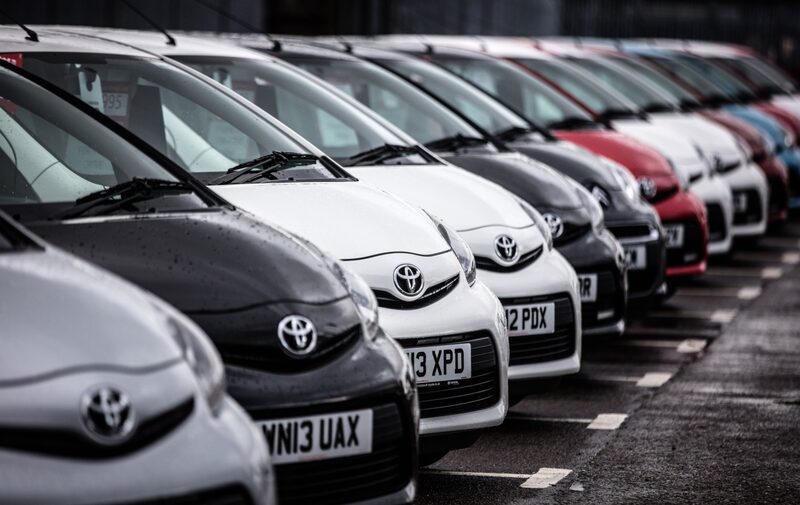 A line of Toyota cars are offered for sale on the forecourt of a main motor car dealer in Brislington on October 6, 2015 in Bristol, England. A line of Toyota cars are offered for sale on the forecourt of a main motor car dealer in Brislington on October 6, 2015 in Bristol, England.
