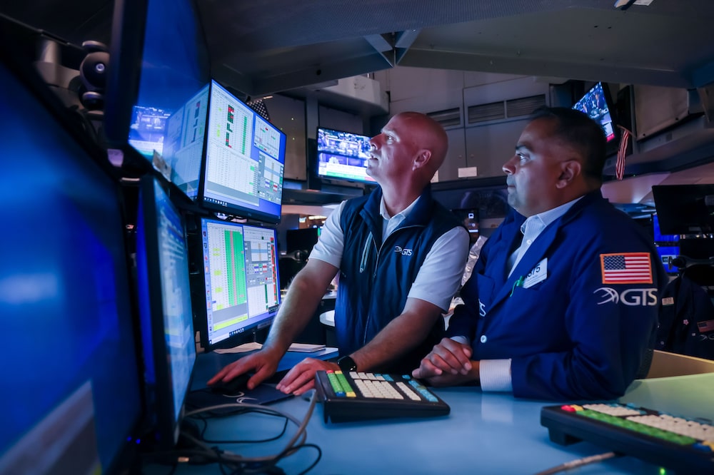 Traders at the New York Stock Exchange (NYSE) in New York, US, on Wednesday, Aug. 13, 2025. Traders at the New York Stock Exchange (NYSE) in New York, US, on Wednesday, Aug. 13, 2025.