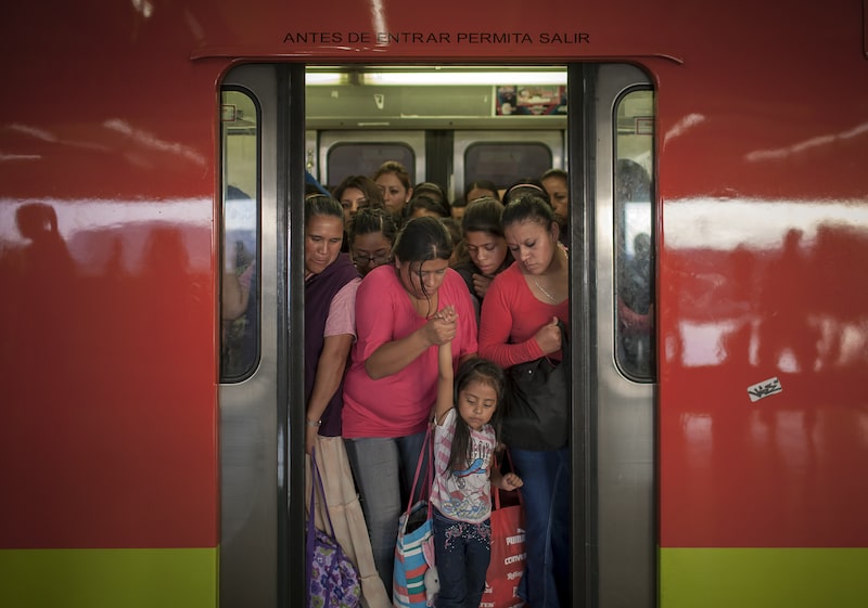 A woman holds a young girl's hand as they exit a train at the Pantitlan Metro station in Mexico City, Mexico, on Tuesday, Sept. 8, 2015. Mexico City has the second-largest metro system in North America after New York, with 12 lines and 195 stations serving a population of 20.1 million people in the metropolitan area. Photographer: Christian Rodriguez/Bloomberg A woman holds a young girl's hand as they exit a train at the Pantitlan Metro station in Mexico City, Mexico, on Tuesday, Sept. 8, 2015. Mexico City has the second-largest metro system in North America after New York, with 12 lines and 195 stations serving a population of 20.1 million people in the metropolitan area. Photographer: Christian Rodriguez/Bloomberg