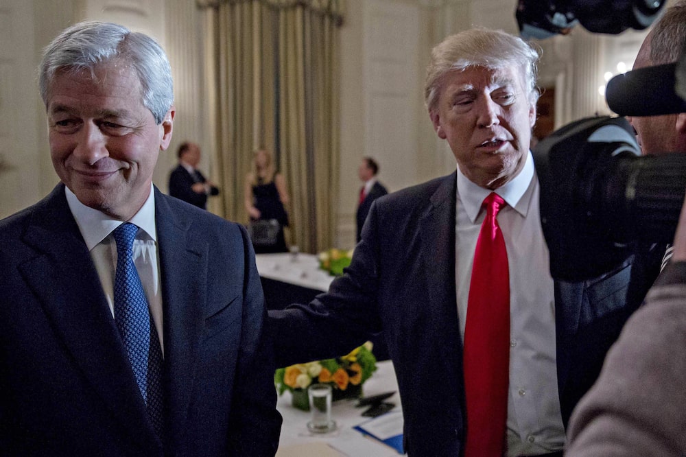 U.S. President Donald Trump stands next to Jamie Dimon, chief executive officer of JPMorgan Chase & Co., left, as he greets attendees during a Strategic and Policy Forum meeting in the State Dining Room of the White House in Washington, D.C., U.S., on Friday, Feb. 3, 2017. The gathering of the 18-member group, led by Blackstone Group LP CEO Steve Schwarzman, will give Americas first billionaire commander-in-chief a chance to reprise his Apprentice role on a grand scale. Photographer: Andrew Harrer/Bloomberg via Getty Images U.S. President Donald Trump stands next to Jamie Dimon, chief executive officer of JPMorgan Chase & Co., left, as he greets attendees during a Strategic and Policy Forum meeting in the State Dining Room of the White House in Washington, D.C., U.S., on Friday, Feb. 3, 2017. The gathering of the 18-member group, led by Blackstone Group LP CEO Steve Schwarzman, will give Americas first billionaire commander-in-chief a chance to reprise his Apprentice role on a grand scale. Photographer: Andrew Harrer/Bloomberg via Getty Images