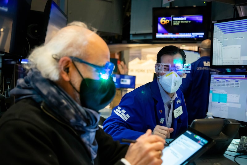 Traders wear "2022" glasses while working on the floor of the New York Stock Exchange (NYSE) in New York, U.S., on Friday, Dec. 31, 2021. U.S. stocks swung between gains and losses, with moves exacerbated by thin trading on the last session of the year. Photographer: Michael Nagle/Bloomberg Traders wear "2022" glasses while working on the floor of the New York Stock Exchange (NYSE) in New York, U.S., on Friday, Dec. 31, 2021. U.S. stocks swung between gains and losses, with moves exacerbated by thin trading on the last session of the year. Photographer: Michael Nagle/Bloomberg