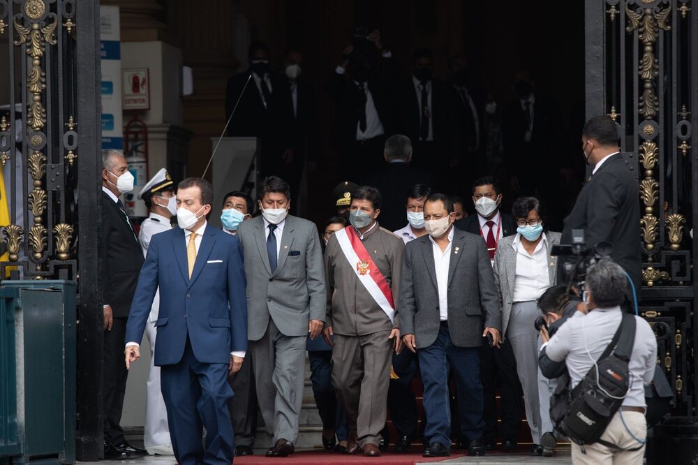 Pedro Castillo, Peru's president, center, leaves for an impeachment hearing at the Congress of the Republic in Lima, Peru, on Monday, March 28, 2022. Castillo faces the second impeachment attempt against him by the country's congress in eight months. Pedro Castillo, Peru's president, center, leaves for an impeachment hearing at the Congress of the Republic in Lima, Peru, on Monday, March 28, 2022. Castillo faces the second impeachment attempt against him by the country's congress in eight months.