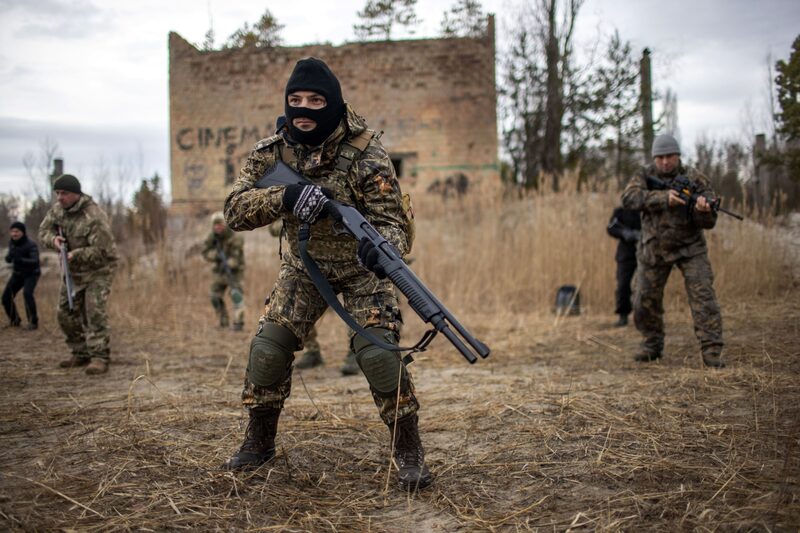Members of Ukraine's Territorial Defense Forces participate in firearm drills during training at a former asphalt factory on the outskirts of Kyiv, Ukraine, on Saturday, Feb. 19, 2022. The U.S. has ramped up warnings of a possible Russian attack on Ukraine, Russian officials said no invasion of Ukraine was underway and none was planned. Photographer: Ethan Swope/Bloomberg Members of Ukraine's Territorial Defense Forces participate in firearm drills during training at a former asphalt factory on the outskirts of Kyiv, Ukraine, on Saturday, Feb. 19, 2022. The U.S. has ramped up warnings of a possible Russian attack on Ukraine, Russian officials said no invasion of Ukraine was underway and none was planned. Photographer: Ethan Swope/Bloomberg