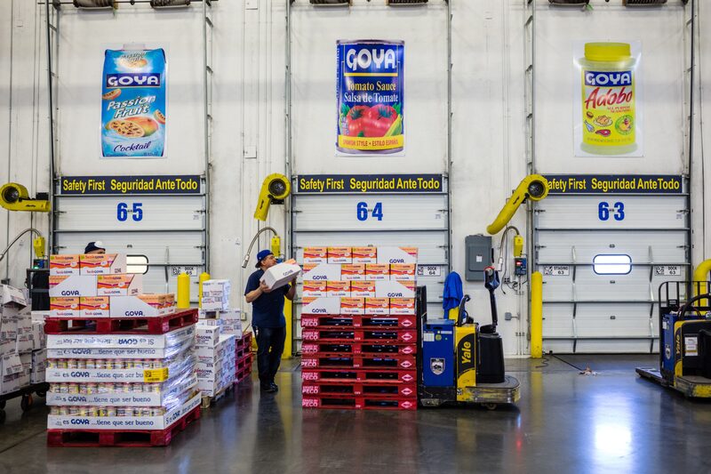 An employee stacks boxes of Goya Foods Inc. seasoning products on top of pallets at the company's distribution warehouse in Jersey City, New Jersey. An employee stacks boxes of Goya Foods Inc. seasoning products on top of pallets at the company's distribution warehouse in Jersey City, New Jersey.