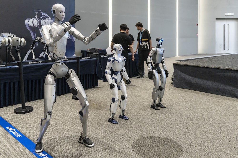 Unitree Robotics humanoid robots Unitree H2, from left, Unitree R1 and Unitree G1 on display at the company's headquarters in Hangzhou, China, on Tuesday, June 2, 2026. China is pitching itself as the global fulcrum for the next phase of artificial intelligence and a legion of robotics companies is lining up initial public offerings to test investor appetite. Photographer: Qilai Shen/Bloomberg Unitree Robotics humanoid robots Unitree H2, from left, Unitree R1 and Unitree G1 on display at the company's headquarters in Hangzhou, China, on Tuesday, June 2, 2026. China is pitching itself as the global fulcrum for the next phase of artificial intelligence and a legion of robotics companies is lining up initial public offerings to test investor appetite. Photographer: Qilai Shen/Bloomberg