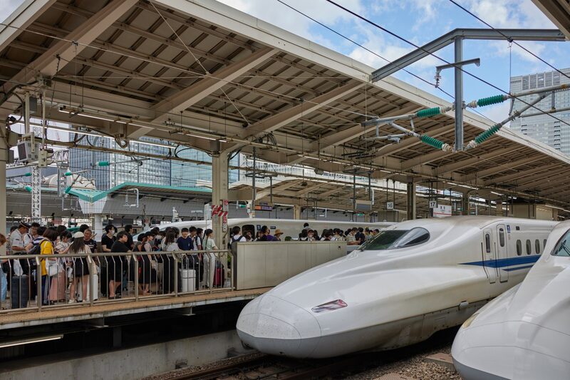Passengers queue to board a Central Japan Railway Co. (JR Central) Shinkansen bullet train at Tokyo Station in Tokyo, Japan, on Aug. 11, 2023. The yen hovered just short of the psychological 145 level versus the dollar on Friday as a persistently wide interest-rate gap with the US weakens the Japanese currency. Photographer: Shoko Takayasu/Bloomberg Passengers queue to board a Central Japan Railway Co. (JR Central) Shinkansen bullet train at Tokyo Station in Tokyo, Japan, on Aug. 11, 2023. The yen hovered just short of the psychological 145 level versus the dollar on Friday as a persistently wide interest-rate gap with the US weakens the Japanese currency. Photographer: Shoko Takayasu/Bloomberg