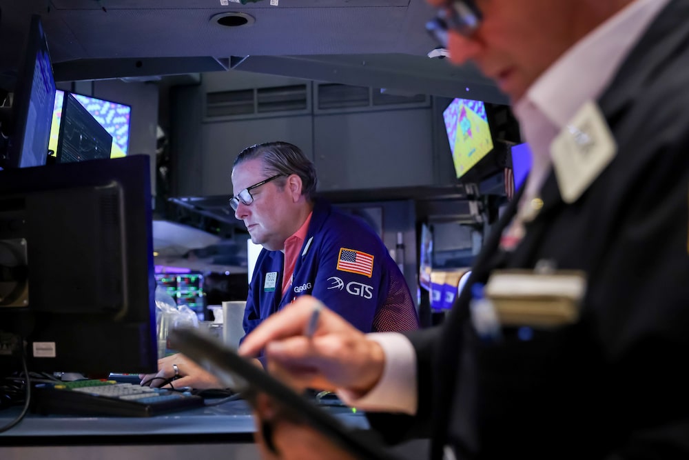 Traders work on the floor of the New York Stock Exchange (NYSE) in New York, US, on Wednesday, Aug. 19, 2026. Wall Street staged a rebound after the Treasury said it plans to boost buybacks of longer-dated bonds, a signal the US wants to lower borrowing costs after yields hit multi-decade highs. Photographer: Michael Nagle/Bloomberg Traders work on the floor of the New York Stock Exchange (NYSE) in New York, US, on Wednesday, Aug. 19, 2026. Wall Street staged a rebound after the Treasury said it plans to boost buybacks of longer-dated bonds, a signal the US wants to lower borrowing costs after yields hit multi-decade highs. Photographer: Michael Nagle/Bloomberg