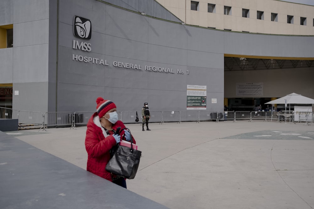 A person wearing a protective mask stands outside the IMSS Hospital General Regional No. 1 in Tijuana, Mexico, on Monday, May 11, 2020. The Covid-19 mortality rate in the border city is twice the national average, the health ministry says, after the outbreak rampaged through hospital wards, the National Post reported. Photographer: Fred Ramos/Bloomberg A person wearing a protective mask stands outside the IMSS Hospital General Regional No. 1 in Tijuana, Mexico, on Monday, May 11, 2020. The Covid-19 mortality rate in the border city is twice the national average, the health ministry says, after the outbreak rampaged through hospital wards, the National Post reported. Photographer: Fred Ramos/Bloomberg
