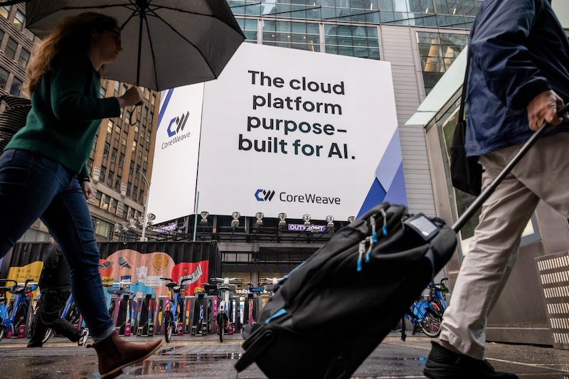 CoreWeave Inc. signage in Times Square. CoreWeave Inc. signage in Times Square.