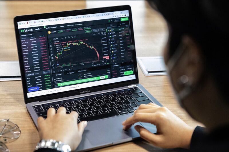 An employee of Bitkub Capital Group Holdings Co., opens the Bitkub page on a laptop at the crypto exchange in Bangkok, Thailand, on Friday, Nov. 26, 2021. Second Sentence. Photographer: Andre Malerba/Bloomberg An employee of Bitkub Capital Group Holdings Co., opens the Bitkub page on a laptop at the crypto exchange in Bangkok, Thailand, on Friday, Nov. 26, 2021. Second Sentence. Photographer: Andre Malerba/Bloomberg