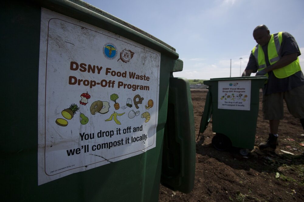 Carlo Rosaeo, an operator for We Care Organics LLC, works to separate compostable materials at a composting pilot program site in the Staten Island borough of New York, U.S., on Saturday, June 29, 2013. New York City will require residents to separate food waste for collection to be composted by 2016, following a voluntary program at 150,000 single-family homes and 100 apartment buildings. Photographer: Scott Eells/Bloomberg *** Local Caption *** Carlo Rosaeo Carlo Rosaeo, an operator for We Care Organics LLC, works to separate compostable materials at a composting pilot program site in the Staten Island borough of New York, U.S., on Saturday, June 29, 2013. New York City will require residents to separate food waste for collection to be composted by 2016, following a voluntary program at 150,000 single-family homes and 100 apartment buildings. Photographer: Scott Eells/Bloomberg *** Local Caption *** Carlo Rosaeo