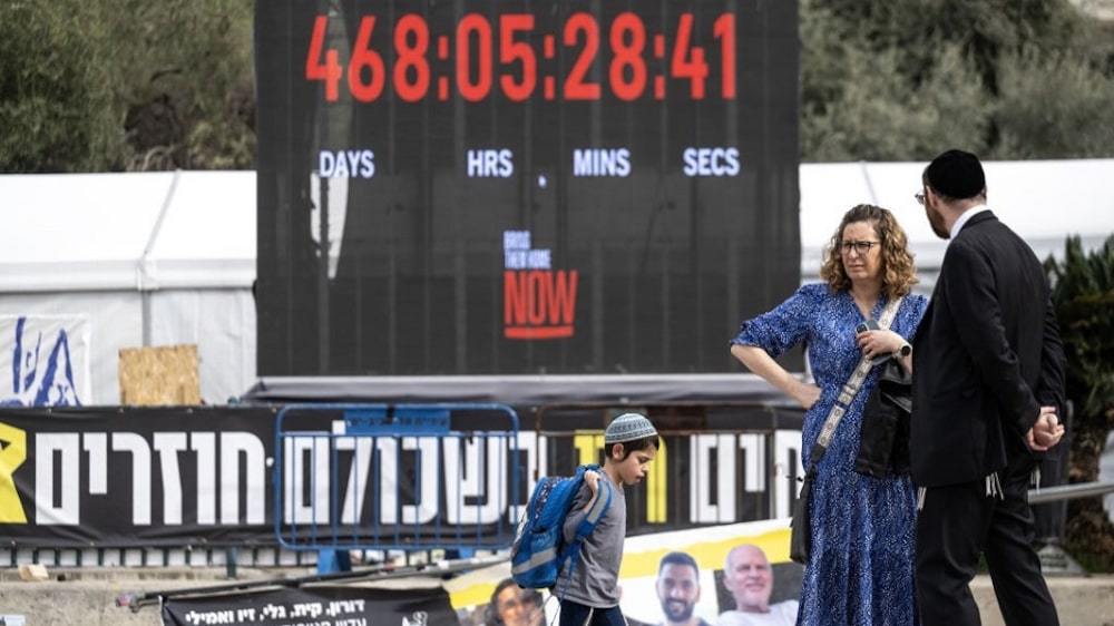 TEL AVIV, ISRAEL - JANUARY 17: The duration of the prisoners' stay in Gaza is displayed on a billboard as the relatives of Israeli hostages in Gaza speak during a press conference on the Gaza ceasefire and prisoner swap deal agreed upon by Israel and Hamas in Tel Aviv, Israel on January 17, 2025. (Photo by Mostafa Alkharouf/Anadolu via Getty Images) TEL AVIV, ISRAEL - JANUARY 17: The duration of the prisoners' stay in Gaza is displayed on a billboard as the relatives of Israeli hostages in Gaza speak during a press conference on the Gaza ceasefire and prisoner swap deal agreed upon by Israel and Hamas in Tel Aviv, Israel on January 17, 2025. (Photo by Mostafa Alkharouf/Anadolu via Getty Images)