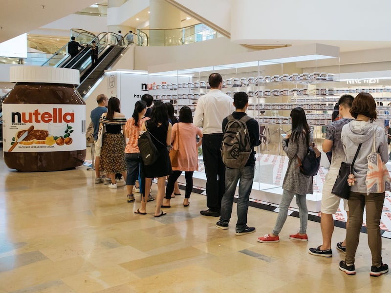 Shoppers stand in line at a Ferrero SpA's Nutella pop up store inside Pacific Place shopping mall in the Admiralty district of Hong Kong, China, on Thursday, Aug. 11, 2016. Nutella, owned by Ferrero, opened its pop-up counter in Pacific Place on Aug. 1. Photographer: Anthony Kwan/Bloomberg Shoppers stand in line at a Ferrero SpA's Nutella pop up store inside Pacific Place shopping mall in the Admiralty district of Hong Kong, China, on Thursday, Aug. 11, 2016. Nutella, owned by Ferrero, opened its pop-up counter in Pacific Place on Aug. 1. Photographer: Anthony Kwan/Bloomberg