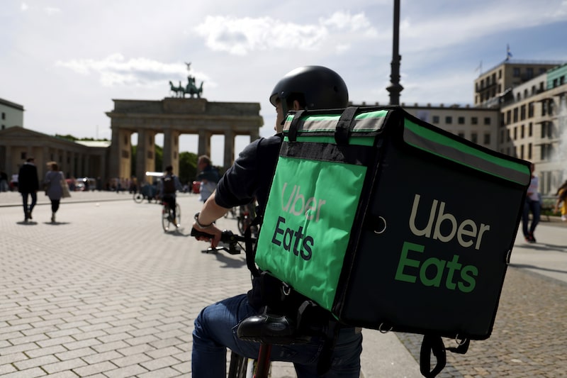 An Uber Eats delivery cyclist in Berlin. An Uber Eats delivery cyclist in Berlin.