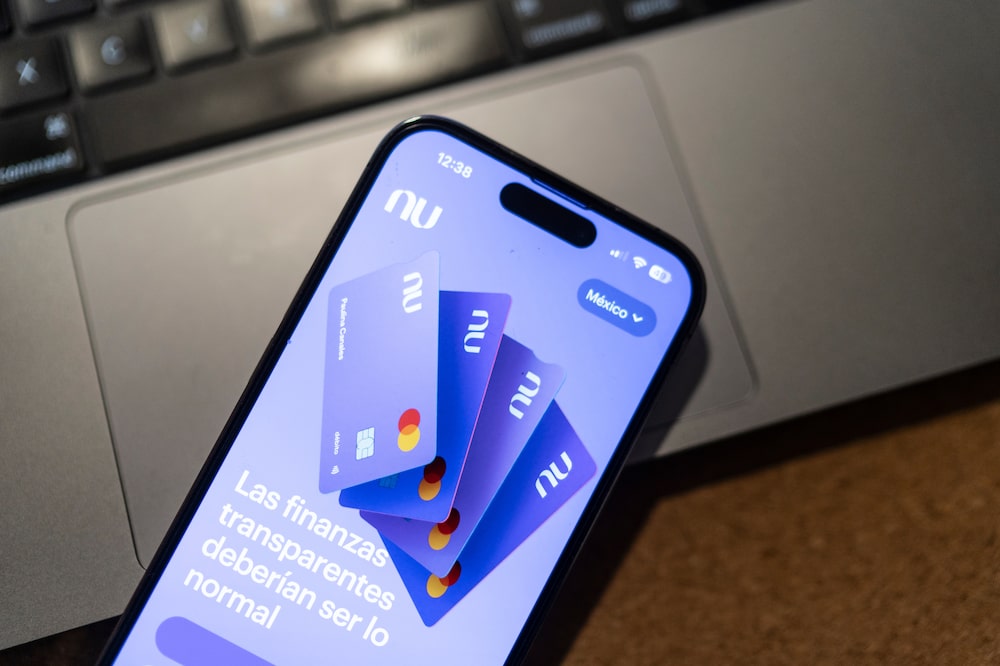 The Nubank mobile app on a smartphone arranged in Mexico City, Mexico, on Saturday, Aug. 5, 2023. Nu Holdings Ltd., the Brazilian digital bank that counts Warren Buffett's Berkshire Hathaway Inc. among its biggest stockholders, is betting big that its high-yield savings accounts will stoke growth in Latin America's second-largest economy. Photographer: Alejandro Cegarra/Bloomberg The Nubank mobile app on a smartphone arranged in Mexico City, Mexico, on Saturday, Aug. 5, 2023. Nu Holdings Ltd., the Brazilian digital bank that counts Warren Buffett's Berkshire Hathaway Inc. among its biggest stockholders, is betting big that its high-yield savings accounts will stoke growth in Latin America's second-largest economy. Photographer: Alejandro Cegarra/Bloomberg
