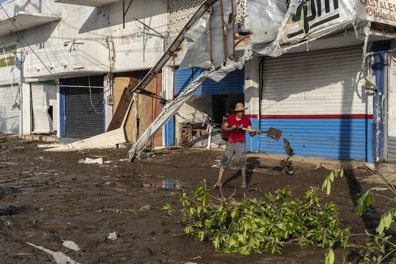 A resident shovels mud in the aftermath of Hurricane Otis in Acapulco, Guerrero state, Mexico, on Thursday, Oct. 26, 2023. Hurricane Otis left a trail of destruction in Acapulco after tearing into the historic Mexican beach town with wind speeds of 165 miles (266 kilometers) per hour, smashing shops and wrecking apartment buildings and hotels. Photographer: Alejandro Cegarra/Bloomberg A resident shovels mud in the aftermath of Hurricane Otis in Acapulco, Guerrero state, Mexico, on Thursday, Oct. 26, 2023. Hurricane Otis left a trail of destruction in Acapulco after tearing into the historic Mexican beach town with wind speeds of 165 miles (266 kilometers) per hour, smashing shops and wrecking apartment buildings and hotels. Photographer: Alejandro Cegarra/Bloomberg