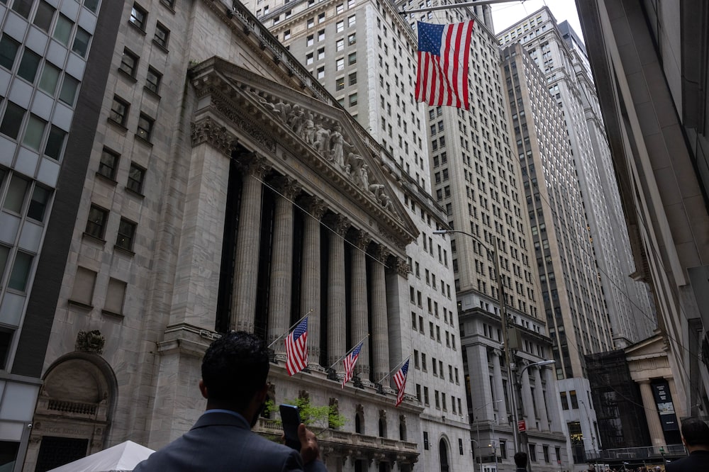 Pedestrians walk along Wall Street near the New York Stock Exchange (NYSE) in New York, US, on Thursday, May 16, 2024. The Dow Jones Industrial Average eclipsed 40,000 for the first time on Thursday as investors grow confident that the stock market rally can keep running on hopes the Federal Reserve will start cutting interest rates later this year. Photographer: Alex Kent/Bloomberg Pedestrians walk along Wall Street near the New York Stock Exchange (NYSE) in New York, US, on Thursday, May 16, 2024. The Dow Jones Industrial Average eclipsed 40,000 for the first time on Thursday as investors grow confident that the stock market rally can keep running on hopes the Federal Reserve will start cutting interest rates later this year. Photographer: Alex Kent/Bloomberg