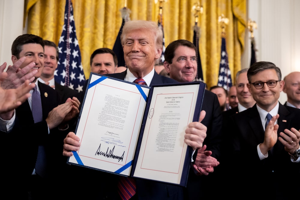 US President Donald Trump displays the signed bill during a signing ceremony for the GENIUS Act in the East Room of the White House in Washington, DC, US, on Friday, July 18, 2025. Trump signed the first federal bill to regulate stablecoins, hailing it as a "giant step to cement American dominance of global finance and crypto technology" and delivering a major victory for the digital asset industry. Photographer: Francis Chung/Politico/Bloomberg US President Donald Trump displays the signed bill during a signing ceremony for the GENIUS Act in the East Room of the White House in Washington, DC, US, on Friday, July 18, 2025. Trump signed the first federal bill to regulate stablecoins, hailing it as a "giant step to cement American dominance of global finance and crypto technology" and delivering a major victory for the digital asset industry. Photographer: Francis Chung/Politico/Bloomberg
