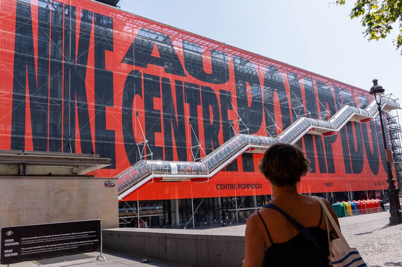 A canvas displaying Nike Inc. branding on the facade of the Centre Pompidou during the Paris 2024 Olympic Games in central Paris, France, on Tuesday, July 30, 2024. New products combined with the Olympics and other major sporting events, could reverse two years of disappointing earnings for Nike. Photographer: Nathan Laine/Bloomberg A canvas displaying Nike Inc. branding on the facade of the Centre Pompidou during the Paris 2024 Olympic Games in central Paris, France, on Tuesday, July 30, 2024. New products combined with the Olympics and other major sporting events, could reverse two years of disappointing earnings for Nike. Photographer: Nathan Laine/Bloomberg