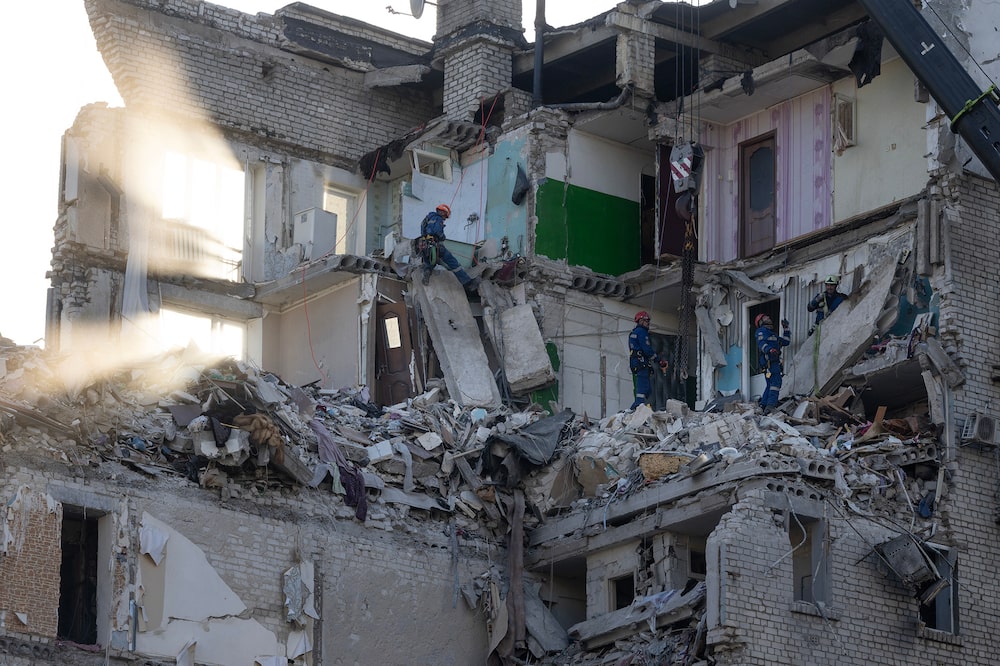 KYIV, UKRAINE - JULY 2: Rescue workers continue to search for survivors by digging through the rubble of a residential building that collapsed after a drone and missile attack by Russian forces on July 2, 2026 in Kyiv, Ukraine. The attack hit multiple buildings in different neighborhoods of the Ukrainian capital, leaving at least 17 dead, according to early statements from Ukrainian authorities. (Photo by Paula Bronstein/Getty Images) KYIV, UKRAINE - JULY 2: Rescue workers continue to search for survivors by digging through the rubble of a residential building that collapsed after a drone and missile attack by Russian forces on July 2, 2026 in Kyiv, Ukraine. The attack hit multiple buildings in different neighborhoods of the Ukrainian capital, leaving at least 17 dead, according to early statements from Ukrainian authorities. (Photo by Paula Bronstein/Getty Images)