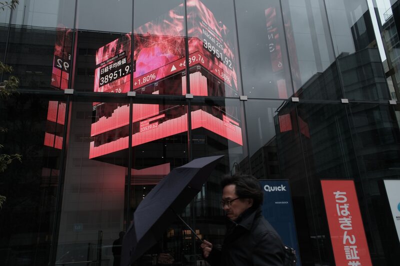 An electronic stock board displayed inside the Kabuto One building in Tokyo, Japan, on Thursday, Feb. 22, 2024. Japanese stocks reclaimed a historic peak reached more than three decades ago as investors pour money into a country that's finally escaped deflation and is on a path to sustainable growth. Photographer: Soichiro Koriyama/Bloomberg An electronic stock board displayed inside the Kabuto One building in Tokyo, Japan, on Thursday, Feb. 22, 2024. Japanese stocks reclaimed a historic peak reached more than three decades ago as investors pour money into a country that's finally escaped deflation and is on a path to sustainable growth. Photographer: Soichiro Koriyama/Bloomberg
