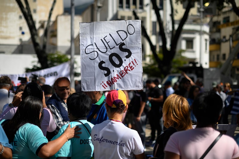 Demonstrators during a protest in support of public sector workers outside the Public Ministry of Venezuela headquarters in Caracas, Venezuela, on Tuesday, Jan. 9, 2024. Venezuela's monthly consumer price index saw a 2.1% uptick month over month, with deceleration of 2023 accrued inflation compared to 2022 due to central bank containment strategy to halt the depreciation of the bolivar, and the governments policy of reducing workers inflation-adjusted wages. Photographer: Gaby Oraa/Bloomberg Demonstrators during a protest in support of public sector workers outside the Public Ministry of Venezuela headquarters in Caracas, Venezuela, on Tuesday, Jan. 9, 2024. Venezuela's monthly consumer price index saw a 2.1% uptick month over month, with deceleration of 2023 accrued inflation compared to 2022 due to central bank containment strategy to halt the depreciation of the bolivar, and the governments policy of reducing workers inflation-adjusted wages. Photographer: Gaby Oraa/Bloomberg
