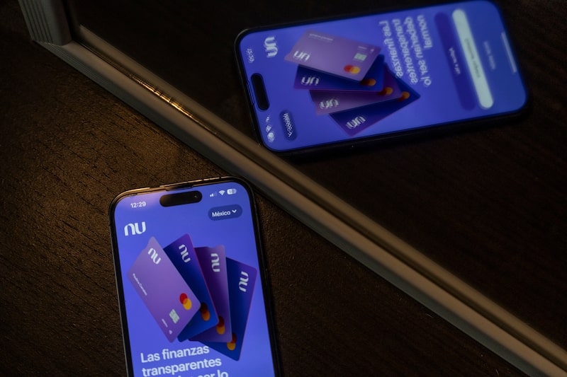 The Nubank mobile app on a smartphone arranged in Mexico City, Mexico, on Saturday, Aug. 5, 2023. Nu Holdings Ltd., the Brazilian digital bank that counts Warren Buffett's Berkshire Hathaway Inc. among its biggest stockholders, is betting big that its high-yield savings accounts will stoke growth in Latin America's second-largest economy. Photographer: Alejandro Cegarra/Bloomberg The Nubank mobile app on a smartphone arranged in Mexico City, Mexico, on Saturday, Aug. 5, 2023. Nu Holdings Ltd., the Brazilian digital bank that counts Warren Buffett's Berkshire Hathaway Inc. among its biggest stockholders, is betting big that its high-yield savings accounts will stoke growth in Latin America's second-largest economy. Photographer: Alejandro Cegarra/Bloomberg