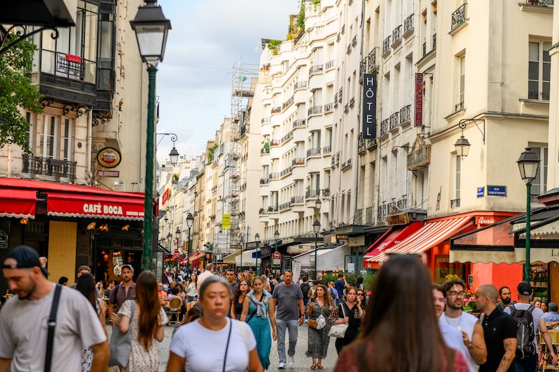 Residents and tourists in the Les Halles district of Paris Residents and tourists in the Les Halles district of Paris