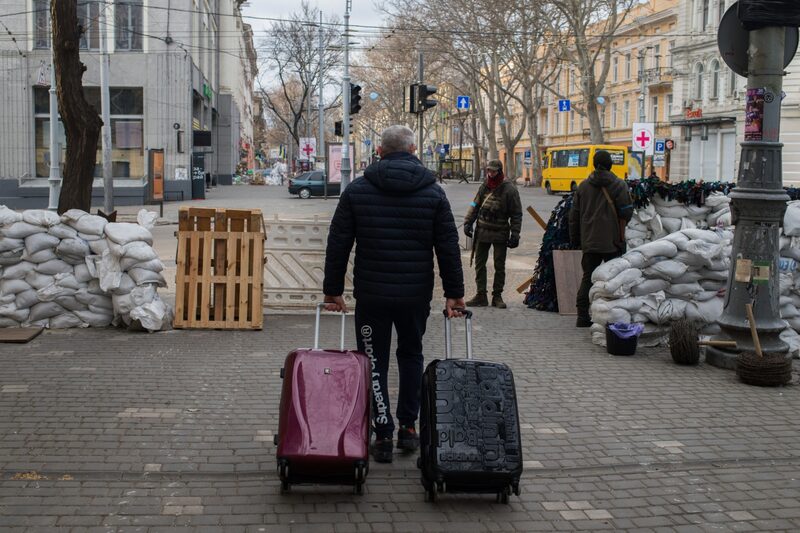 A fleeing resident approaches Ukrainian soldiers at a checkpoint in the center of Odesa, Ukraine, on Friday, March 18, 2022. While Russian landing craft have gathered off Odesa's Black Sea coast several times over the last two weeks as if to attack, a sea landing would be difficult and suitable beaches have been mined and are defended. Photographer: Nathan Laine/Bloomberg A fleeing resident approaches Ukrainian soldiers at a checkpoint in the center of Odesa, Ukraine, on Friday, March 18, 2022. While Russian landing craft have gathered off Odesa's Black Sea coast several times over the last two weeks as if to attack, a sea landing would be difficult and suitable beaches have been mined and are defended. Photographer: Nathan Laine/Bloomberg