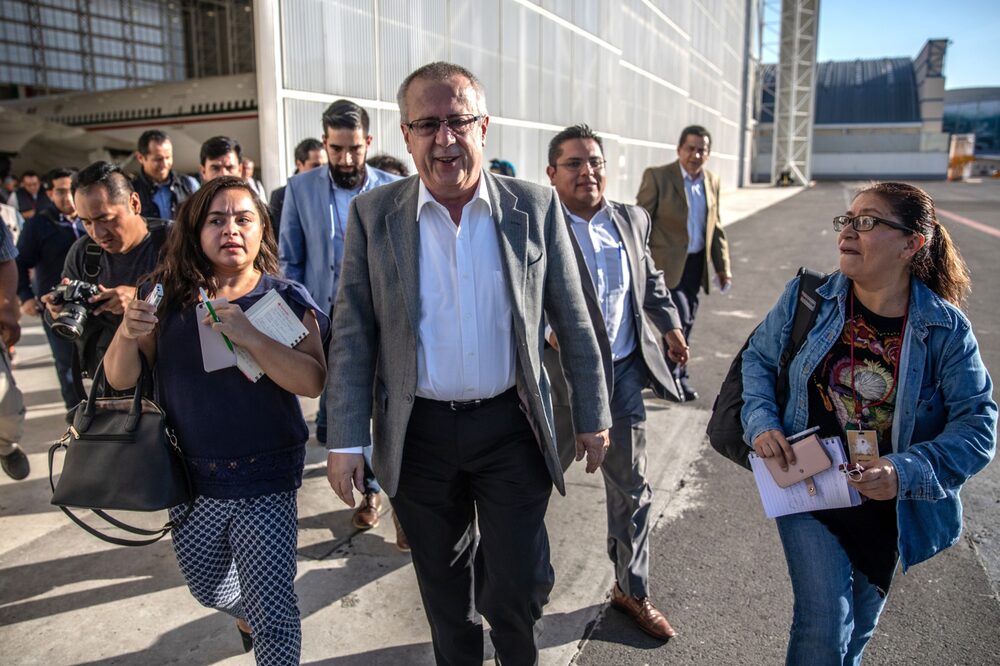 Carlos Urzua, Mexico's finance minister, center, leaves after a press conference in Mexico City, Mexico, on Sunday, Dec. 2, 2018. Mexican President Andres Manuel Lopez Obrador is fulfilling a campaign promise by selling the Boeing 787 Dreamliner thats transported former President Enrique Pena Nieto since 2016. Photographer: Alejandro Cegarra/Bloomberg Carlos Urzua, Mexico's finance minister, center, leaves after a press conference in Mexico City, Mexico, on Sunday, Dec. 2, 2018. Mexican President Andres Manuel Lopez Obrador is fulfilling a campaign promise by selling the Boeing 787 Dreamliner thats transported former President Enrique Pena Nieto since 2016. Photographer: Alejandro Cegarra/Bloomberg