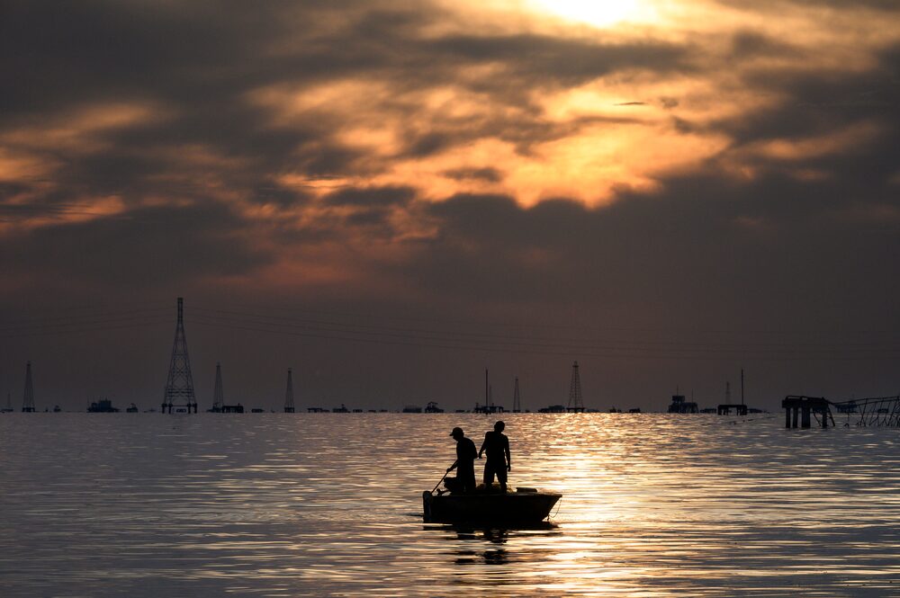 Fishermen in front of Petroleos de Venezuela SA (PDVSA) oil rigs on lake Maracaibo in Cabimas, Zulia state, Venezuela, on Wednesday, Nov. 15, 2023. A decision by the US on Oct. 18 to ease sanctions in exchange for greater political freedom in Venezuela, has opened the doors for dealmaking and increased production that will enable the Latin American country's crude to reach global markets. Photographer: Gaby Oraa/Bloomberg Fishermen in front of Petroleos de Venezuela SA (PDVSA) oil rigs on lake Maracaibo in Cabimas, Zulia state, Venezuela, on Wednesday, Nov. 15, 2023. A decision by the US on Oct. 18 to ease sanctions in exchange for greater political freedom in Venezuela, has opened the doors for dealmaking and increased production that will enable the Latin American country's crude to reach global markets. Photographer: Gaby Oraa/Bloomberg