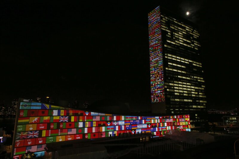 NEW YORK, NY - SEPTEMBER 22: Big scale projections are seen over the general assembly building at United Nations headquarters on September 22, 2015 in New York City. The projections and peoples voices are projected during the celebration of UN70 and visually depict the 17 Global Goals. (Kena Betancur/Getty Images for Global Goals) NEW YORK, NY - SEPTEMBER 22: Big scale projections are seen over the general assembly building at United Nations headquarters on September 22, 2015 in New York City. The projections and peoples voices are projected during the celebration of UN70 and visually depict the 17 Global Goals. (Kena Betancur/Getty Images for Global Goals)