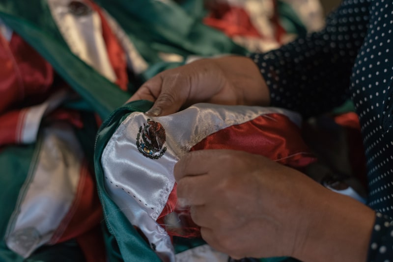 A workers sews a Mexican flags at a manufacturing facility in Toluca, Mexico state, Mexico, on Friday, Aug. 2, 2019. Most yields along the Mexico dollar sovereign yield curve fell, while 2-year yields rose in Tuesday morning trading. Photographer: Luis Antonio Rojas/Bloomberg A workers sews a Mexican flags at a manufacturing facility in Toluca, Mexico state, Mexico, on Friday, Aug. 2, 2019. Most yields along the Mexico dollar sovereign yield curve fell, while 2-year yields rose in Tuesday morning trading. Photographer: Luis Antonio Rojas/Bloomberg