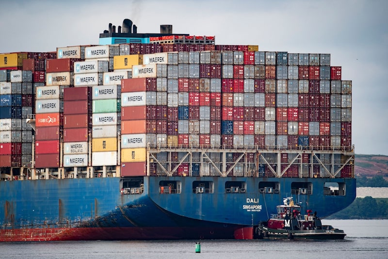 A tug boat guides the Dali container vessel in Baltimore, Maryland, US, on Monday, May 20, 2024. After eighteen hours of preparations to refloat the ship that destroyed Baltimore's Francis Scott Key Bridge, the Dali container vessel is being moved to a nearby dock, as officials continue clearing the channel of wreckage that's blocked the city's port for almost two months. Photographer: Al Drago/Bloomberg A tug boat guides the Dali container vessel in Baltimore, Maryland, US, on Monday, May 20, 2024. After eighteen hours of preparations to refloat the ship that destroyed Baltimore's Francis Scott Key Bridge, the Dali container vessel is being moved to a nearby dock, as officials continue clearing the channel of wreckage that's blocked the city's port for almost two months. Photographer: Al Drago/Bloomberg