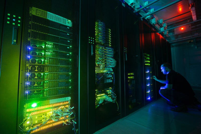 An employee inspects the Sberbank and SberCloud Christofari supercomputer during an event to mark its launch into commercial operation inside the Sberbank PJSC data processing center (DPC) at the Skolkovo Innovation Center in Moscow, Russia, on Monday, Dec. 16, 2019. As Sberbank expands its technology offerings, the Kremlin is backing legislation aimed at keeping the country's largest internet companies under local control by limiting foreign ownership. Photographer: Andrey Rudakov/Bloomberg An employee inspects the Sberbank and SberCloud Christofari supercomputer during an event to mark its launch into commercial operation inside the Sberbank PJSC data processing center (DPC) at the Skolkovo Innovation Center in Moscow, Russia, on Monday, Dec. 16, 2019. As Sberbank expands its technology offerings, the Kremlin is backing legislation aimed at keeping the country's largest internet companies under local control by limiting foreign ownership. Photographer: Andrey Rudakov/Bloomberg