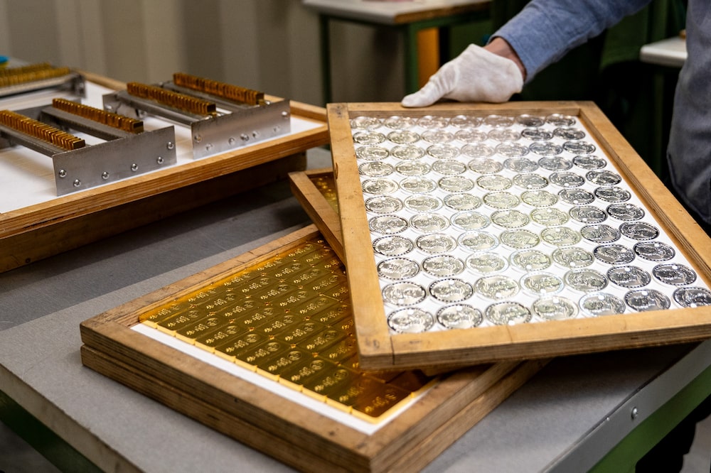 Trays of silver coins and gold bars at the Polish mint, also known as Mennica Polska SA, in Warsaw, Poland, on Thursday, Feb. 12, 2026. Polands central bank, the worlds biggest reported buyer of gold, is boosting purchases by another 150 tons as it braces for more of the geopolitical instability that has driven prices to record highs. Photographer: Damian Lemanski/Bloomberg Trays of silver coins and gold bars at the Polish mint, also known as Mennica Polska SA, in Warsaw, Poland, on Thursday, Feb. 12, 2026. Polands central bank, the worlds biggest reported buyer of gold, is boosting purchases by another 150 tons as it braces for more of the geopolitical instability that has driven prices to record highs. Photographer: Damian Lemanski/Bloomberg