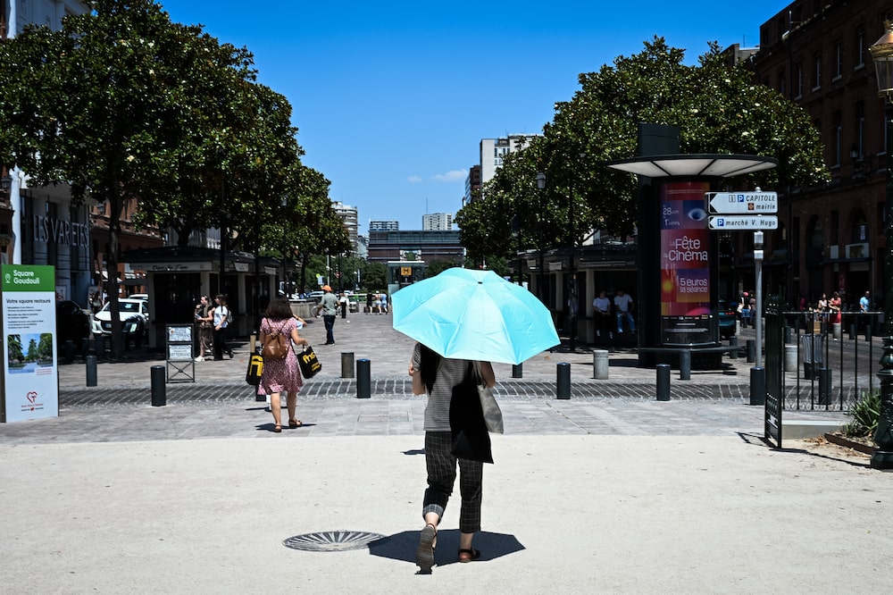 A pedestrian walks beneath an umbrella during high temperatures in central Toulouse, France, on Wednesday, June 24, 2026. France is at the epicenter of this months heat wave, as a high-pressure heat dome is reinforced by atmospheric shifts linked to a developing El Niño. Photographer: Matthieu Rondel/Bloomberg A pedestrian walks beneath an umbrella during high temperatures in central Toulouse, France, on Wednesday, June 24, 2026. France is at the epicenter of this months heat wave, as a high-pressure heat dome is reinforced by atmospheric shifts linked to a developing El Niño. Photographer: Matthieu Rondel/Bloomberg