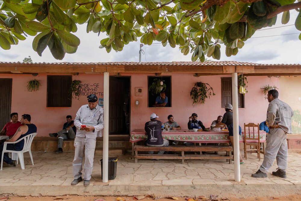 Workers from a nearby wind farm eat lunch in the community. Workers from a nearby wind farm eat lunch in the community.