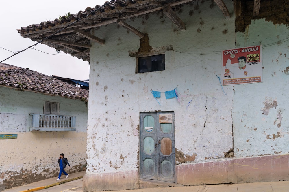 A poster in support of former Peruvian President Pedro Castillo on a building in Anguía District of Chota. Photographer: Angela Ponce/Bloomberg A poster in support of former Peruvian President Pedro Castillo on a building in Anguía District of Chota. Photographer: Angela Ponce/Bloomberg