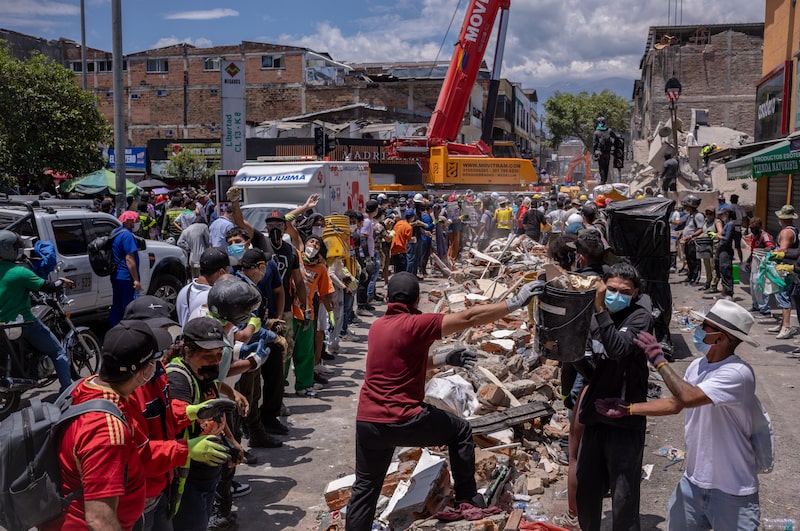 Volunteers and rescue workers remove debris from a collapsed building following an earthquake in Pereira, Colombia, on Tuesday, Aug. 11, 2026. Colombias government plans to declare an economic emergency to bolster its response to a massive earthquake that hit Monday, as the countrys new president faces a tough and early test of his abilities to handle a crisis. Photographer: Nathalia Angarita/Bloomberg Volunteers and rescue workers remove debris from a collapsed building following an earthquake in Pereira, Colombia, on Tuesday, Aug. 11, 2026. Colombias government plans to declare an economic emergency to bolster its response to a massive earthquake that hit Monday, as the countrys new president faces a tough and early test of his abilities to handle a crisis. Photographer: Nathalia Angarita/Bloomberg