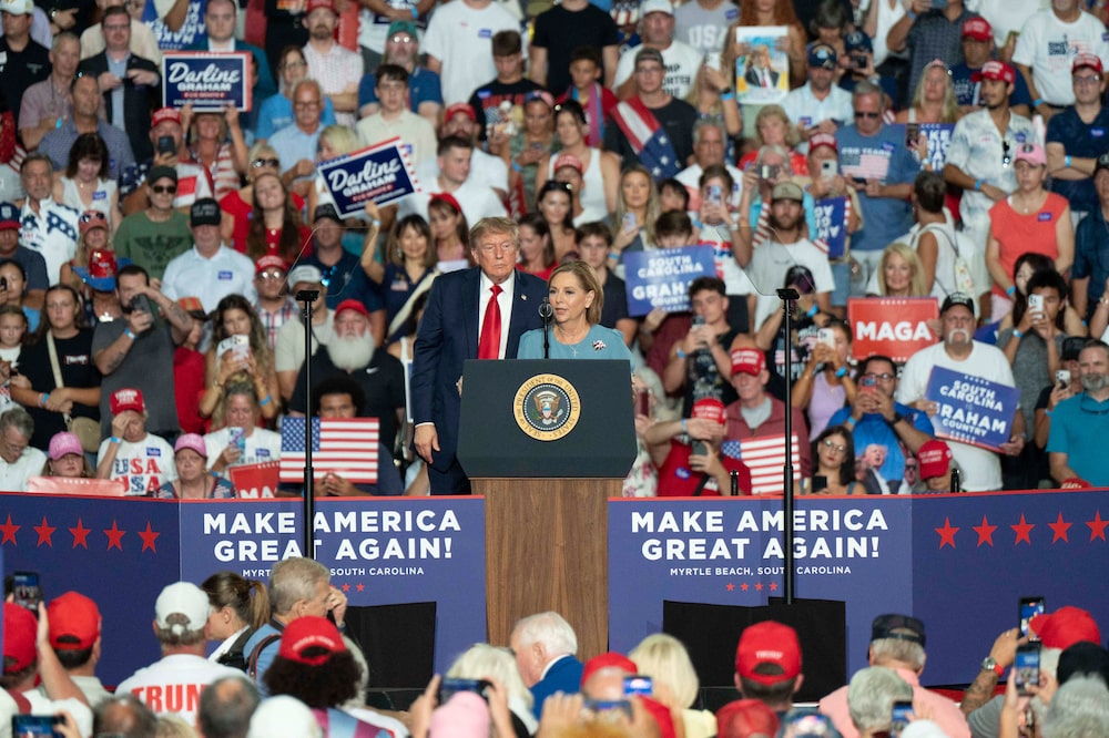 US President Donald Trump, left, and Senator Darline Graham Nordone, a Republican from South Carolina, during a campaign event ahead of a Republican special primary runoff election at the Myrtle Beach Convention Center in Myrtle Beach, South Carolina, US, on Friday, Aug. 21, 2026. South Carolina is holding a Republican special primary runoff election on August 25. Photographer: Allison Joyce/Bloomberg US President Donald Trump, left, and Senator Darline Graham Nordone, a Republican from South Carolina, during a campaign event ahead of a Republican special primary runoff election at the Myrtle Beach Convention Center in Myrtle Beach, South Carolina, US, on Friday, Aug. 21, 2026. South Carolina is holding a Republican special primary runoff election on August 25. Photographer: Allison Joyce/Bloomberg