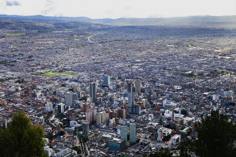 City buildings are seen from Cerro de Monserrate in Bogota, Colombia, on Tuesday, June 16, 2015. Colombia's fiscal deficit will widen next year to the most since 2010 amid lower crude prices, according to the government's latest financial plan. Photographer: Cassi Alexandra/Bloomberg City buildings are seen from Cerro de Monserrate in Bogota, Colombia, on Tuesday, June 16, 2015. Colombia's fiscal deficit will widen next year to the most since 2010 amid lower crude prices, according to the government's latest financial plan. Photographer: Cassi Alexandra/Bloomberg