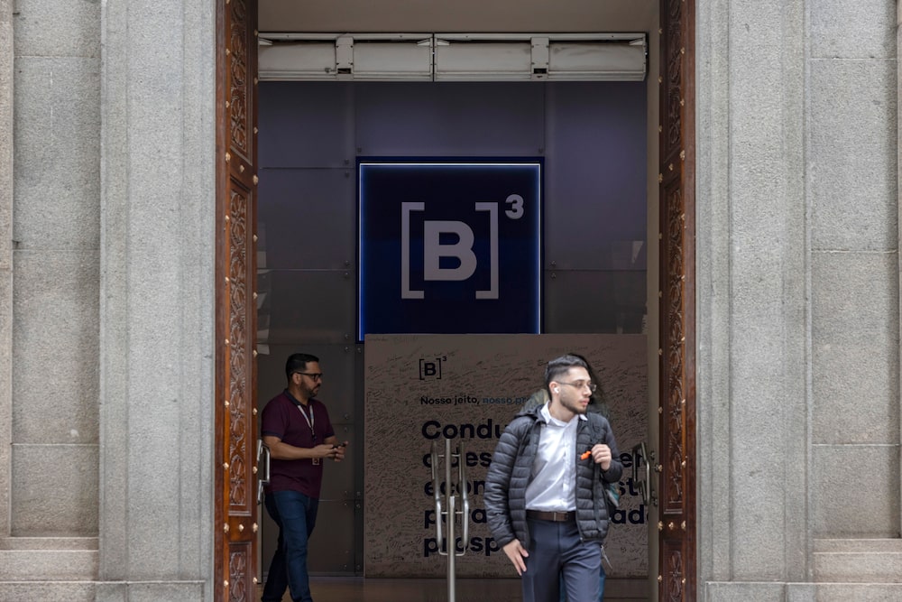 Workers at the Brasil Bolsa Balcao (B3) stock exchange headquarters in the financial district of Sao Paulo, Brazil, on Monday, Oct. 5, 2026. Brazilian assets surged after Senator Flavio Bolsonaro defied polls and became the front-runner to win the Oct. 25 presidential runoff against Luiz Inacio Lula da Silva. Photographer: Victor Moriyama/Bloomberg Workers at the Brasil Bolsa Balcao (B3) stock exchange headquarters in the financial district of Sao Paulo, Brazil, on Monday, Oct. 5, 2026. Brazilian assets surged after Senator Flavio Bolsonaro defied polls and became the front-runner to win the Oct. 25 presidential runoff against Luiz Inacio Lula da Silva. Photographer: Victor Moriyama/Bloomberg
