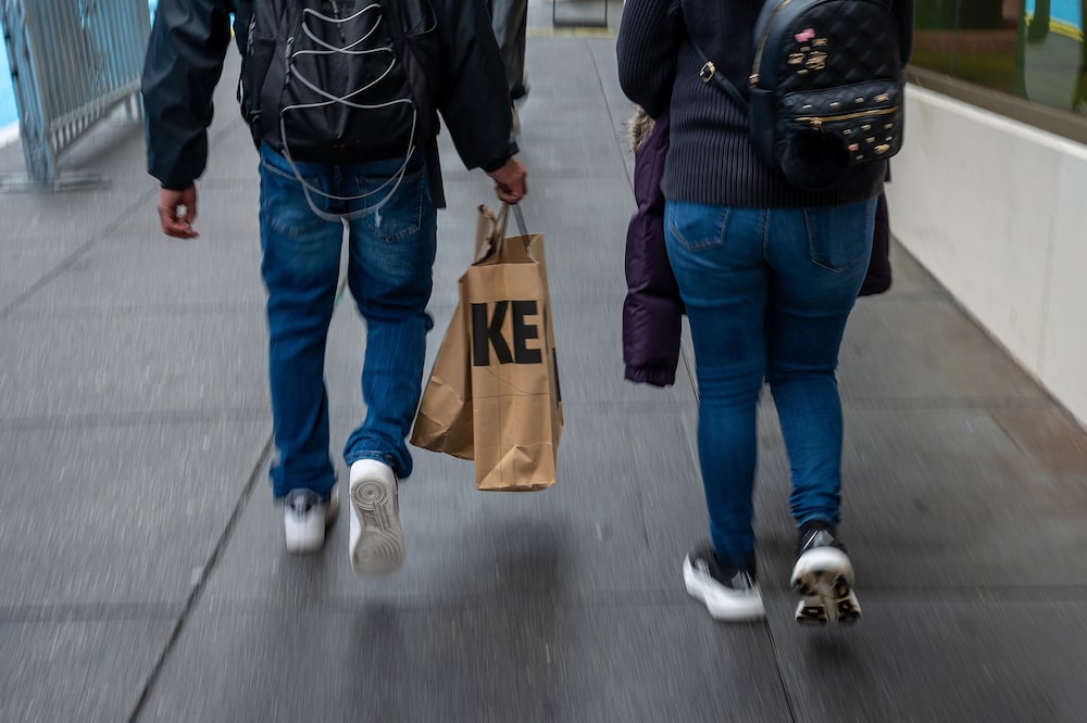 A shopper carries Nike bags in San Francisco, California, US, on Wednesday, Dec. 17, 2025. Nike Inc. is expected to release earnings figures on December 18. Photographer: David Paul Morris/Bloomberg A shopper carries Nike bags in San Francisco, California, US, on Wednesday, Dec. 17, 2025. Nike Inc. is expected to release earnings figures on December 18. Photographer: David Paul Morris/Bloomberg