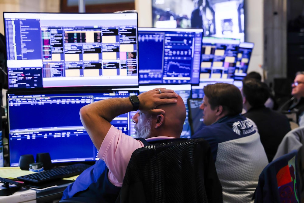 Traders work on the floor of the New York Stock Exchange (NYSE) in New York, US, on Tuesday, July 14, 2026. A cooler-than-estimated inflation reading spurred gains in both stocks and bonds, easing concern about imminent Federal Reserve interest-rate hikes amid a resurgence in oil prices. Photographer: Michael Nagle/Bloomberg Traders work on the floor of the New York Stock Exchange (NYSE) in New York, US, on Tuesday, July 14, 2026. A cooler-than-estimated inflation reading spurred gains in both stocks and bonds, easing concern about imminent Federal Reserve interest-rate hikes amid a resurgence in oil prices. Photographer: Michael Nagle/Bloomberg