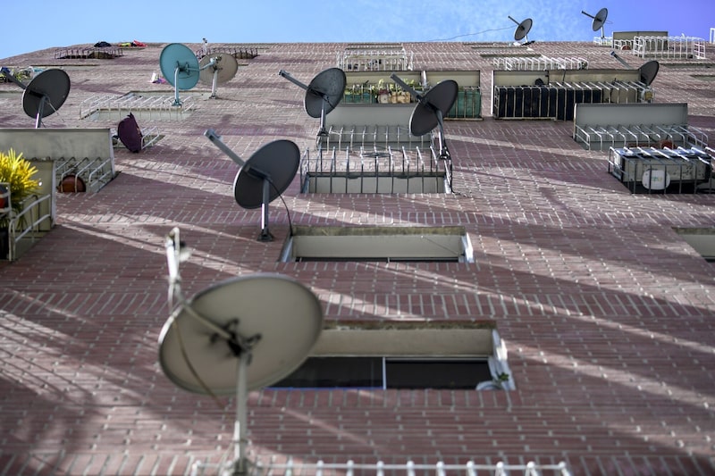 TV Satellite Dishes On A Residential Building TV Satellite Dishes On A Residential Building