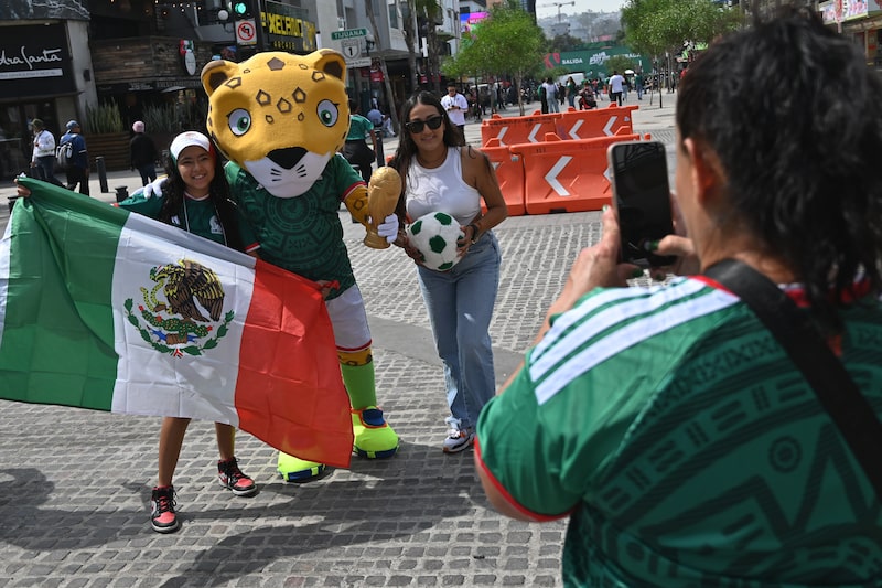 Fans take a photo with a FIFA mascot during the opening match at a World Cup 2026 watch party in Tijuana, Mexico, on Thursday, June 11, 2026. Mexico hosts South Africa for the World Cup opening match Thursday at the historic Estadio Azteca in Mexico City. Photographer: Carlos Moreno/Bloomberg Fans take a photo with a FIFA mascot during the opening match at a World Cup 2026 watch party in Tijuana, Mexico, on Thursday, June 11, 2026. Mexico hosts South Africa for the World Cup opening match Thursday at the historic Estadio Azteca in Mexico City. Photographer: Carlos Moreno/Bloomberg