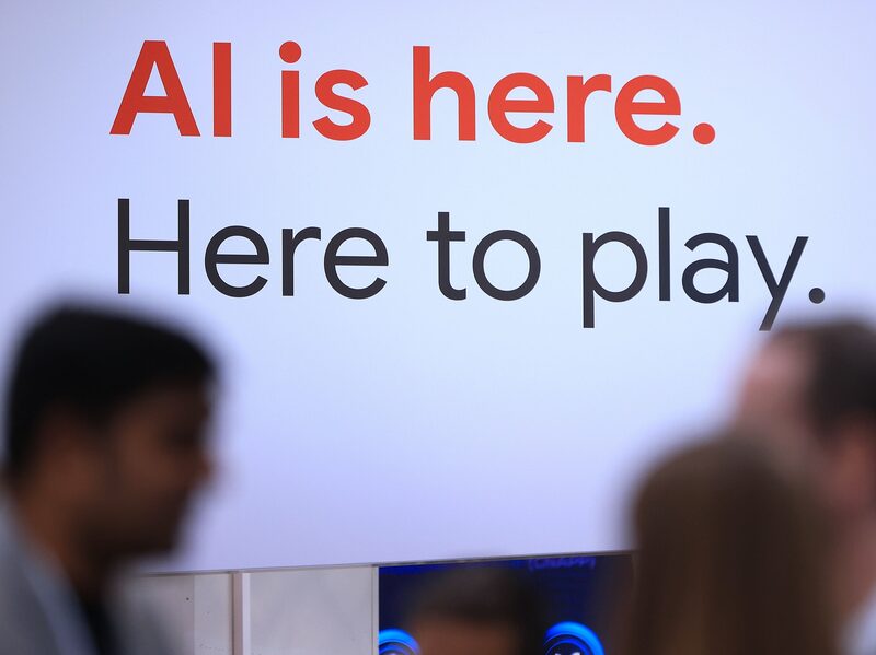 A slogan which reads "AI is here. Here to play", at the Google booth at the Hannover Messe 2024 trade fair in Germany, on April 22. A slogan which reads "AI is here. Here to play", at the Google booth at the Hannover Messe 2024 trade fair in Germany, on April 22.