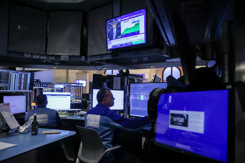 Traders At The New York Stock Exchange As Wall Street On Hold In Run-Up To Nvidia, Jobs Data Traders At The New York Stock Exchange As Wall Street On Hold In Run-Up To Nvidia, Jobs Data